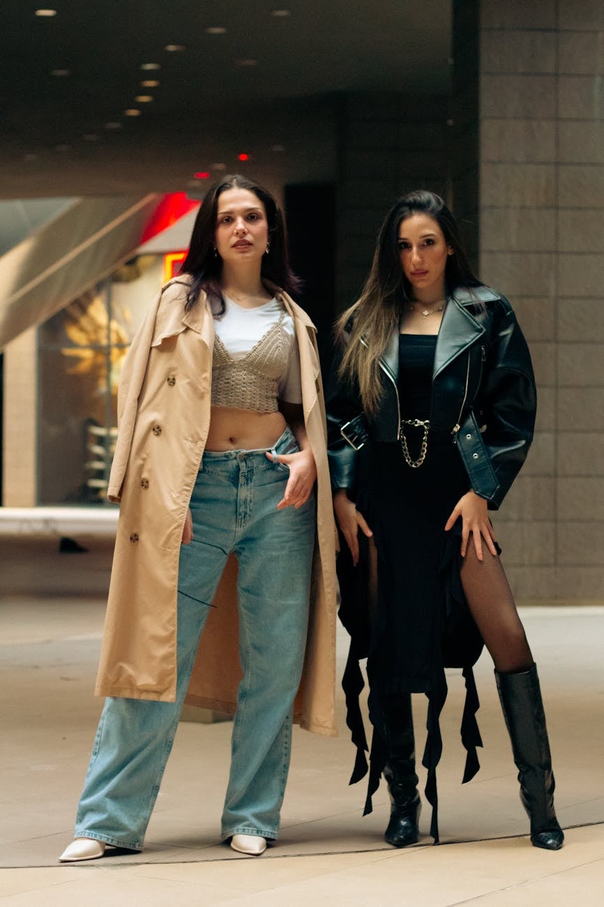 well dressed women standing on walkway